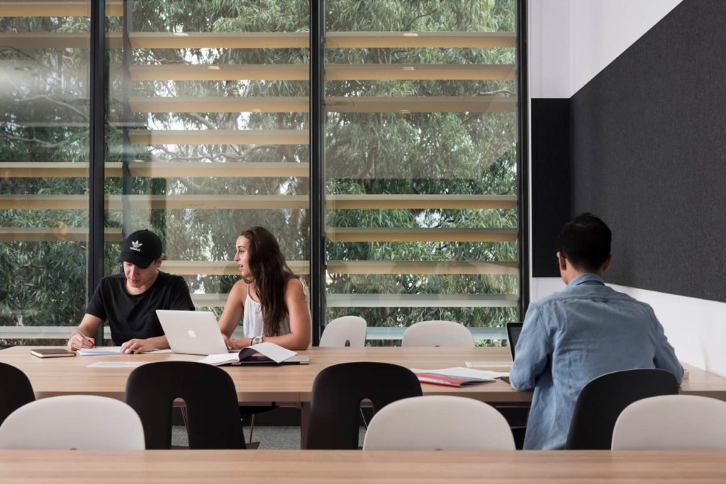 Students using laptops at desks