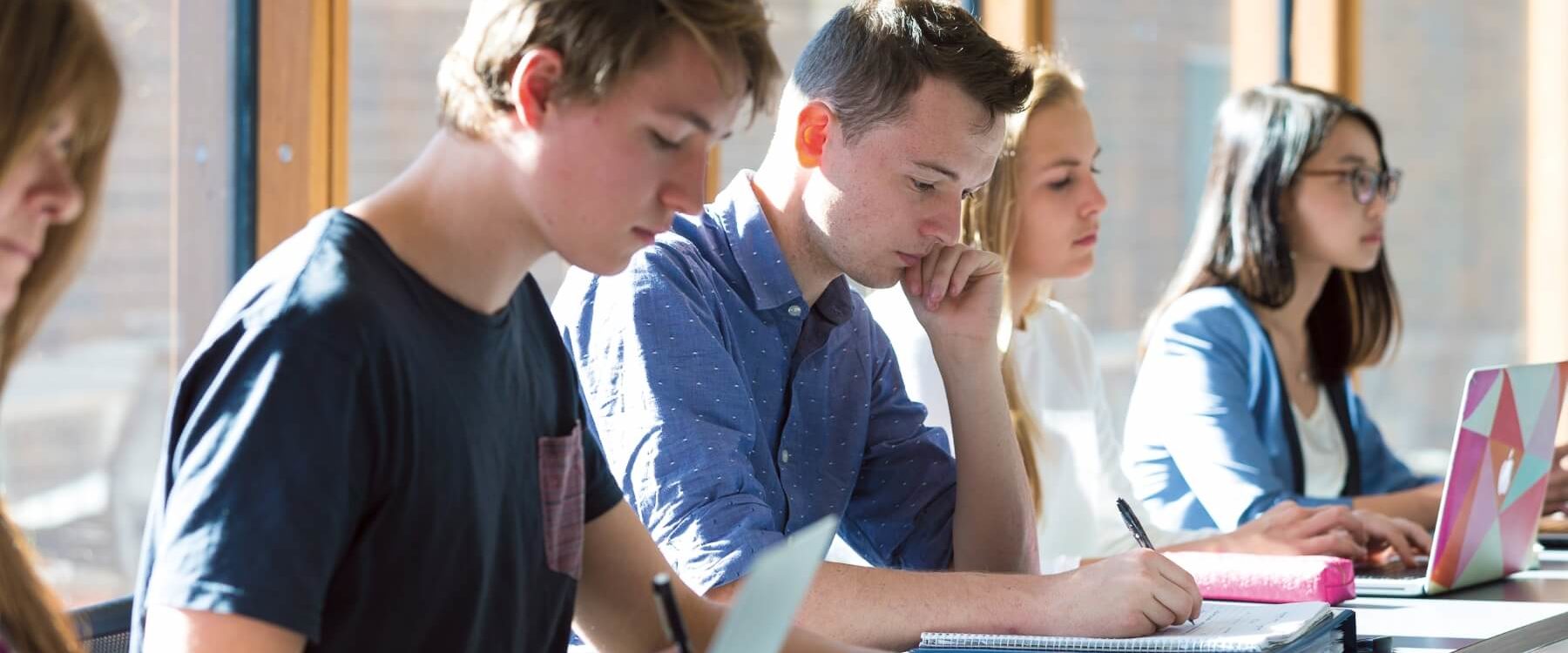 students_studying_at laptops