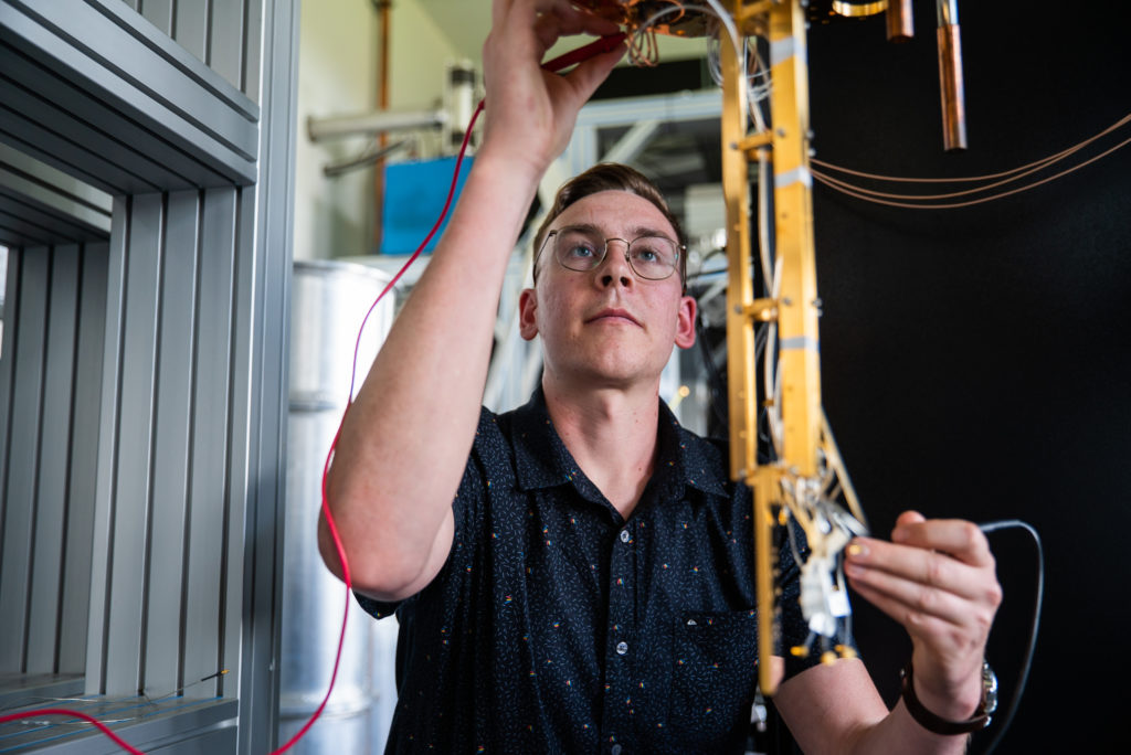 PhD student, Wyatt Vine with equipment