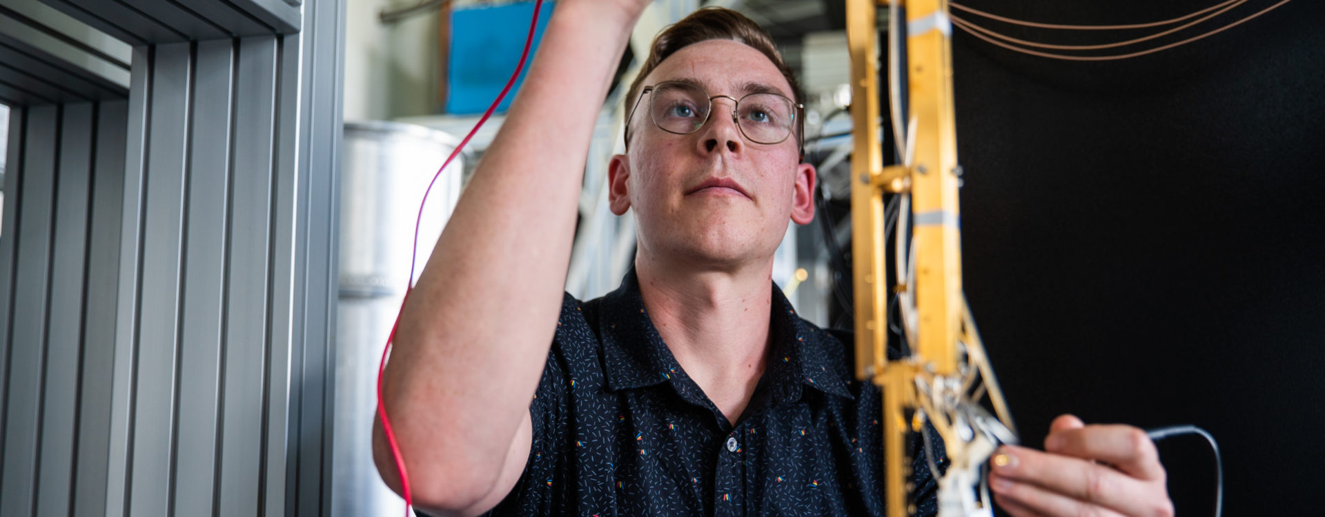 PhD student, Wyatt Vine with equipment