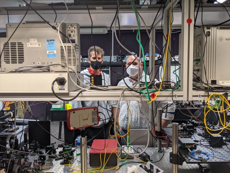 SQA postdoctoral fellow Dr Cyril Laplane and Dr Matt van Breugel in the lab behind wires and technology