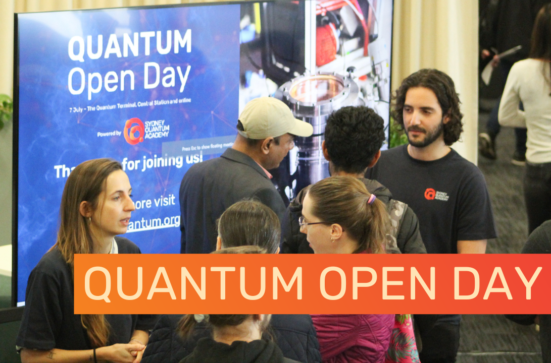 picture of ambassadors chatting to students in front of open day branded screen with words quantum open day inside orange gradient rectangle