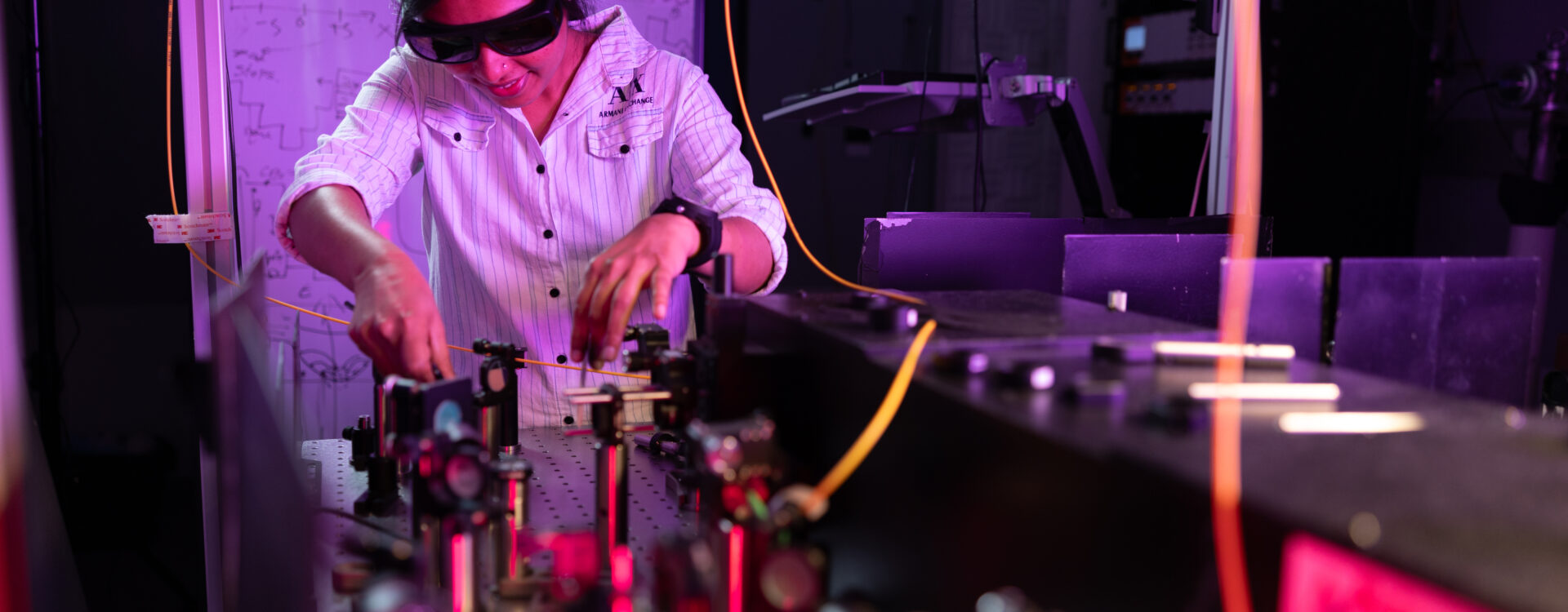 Women wearing glasses and working on devices in Quantum lab